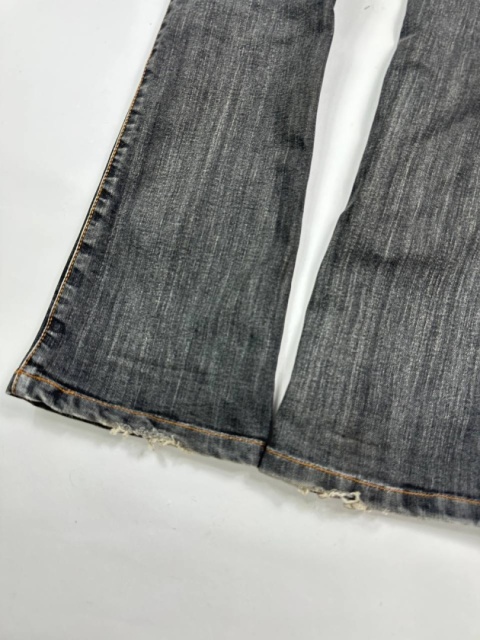 Washed flared denim with flaps